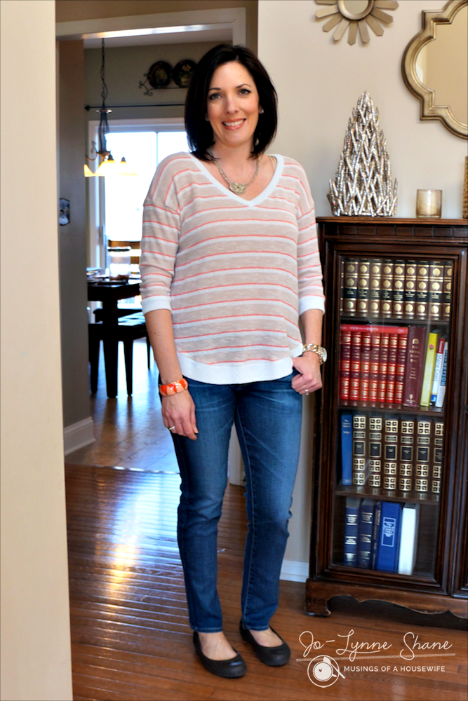 medium wash jeans with coral striped sweater