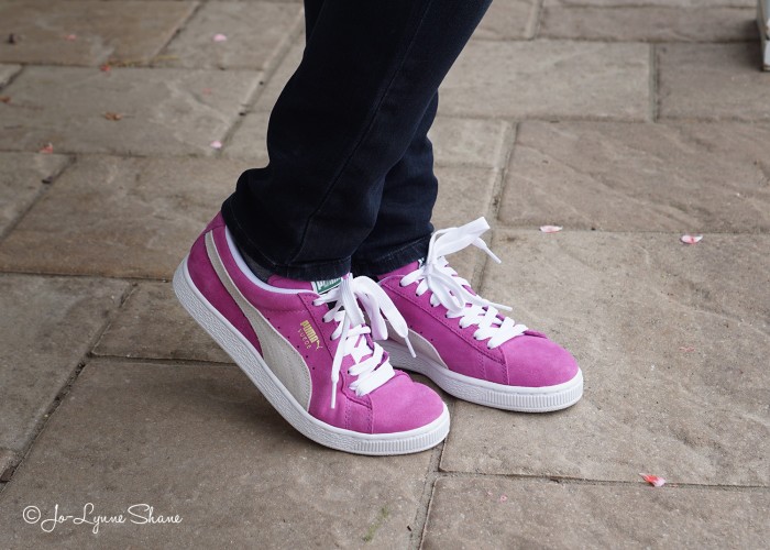 Fashion Over 40: Elevate your t-shirt and jeans with pink Pumas.