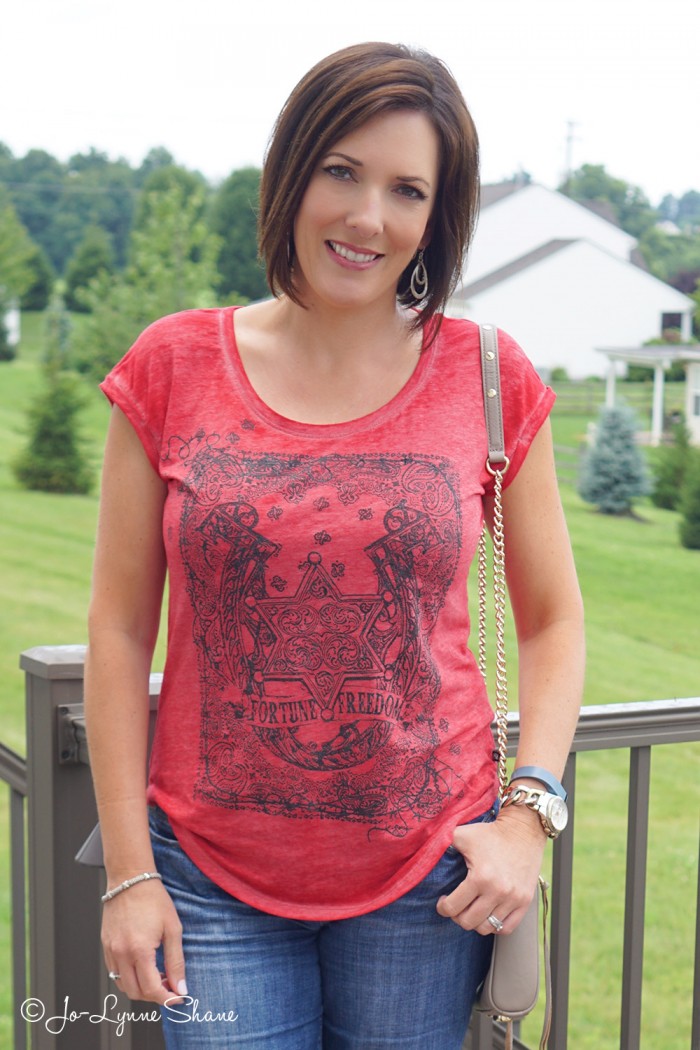 Fashion Over 40: Casual Mom Style in a red graphic burnout tee + cuffed denim bermuda shorts