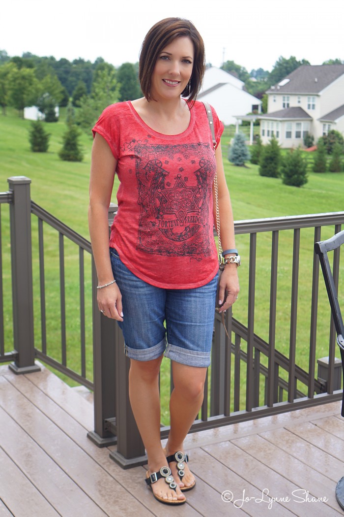 Fashion Over 40: Casual Mom Style in a red graphic burnout tee + cuffed denim bermuda shorts. Sandals by Vionic with Orthaheel technology for comfort and style.