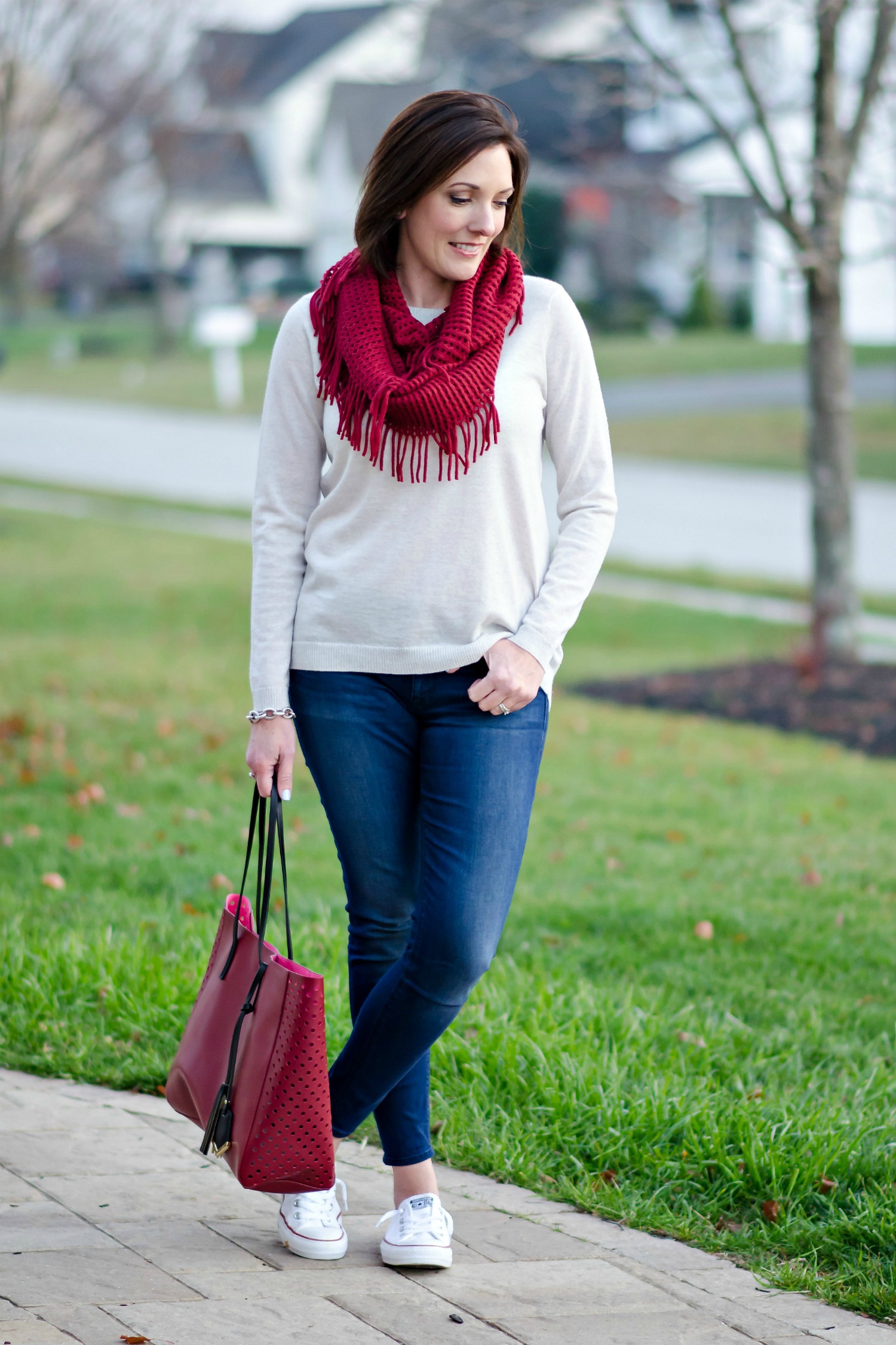 Casual Winter Outfit: Red Fringe Scarf, Relaxed Fit Oatmeal Sweater, Cropped Skinnies and Converse