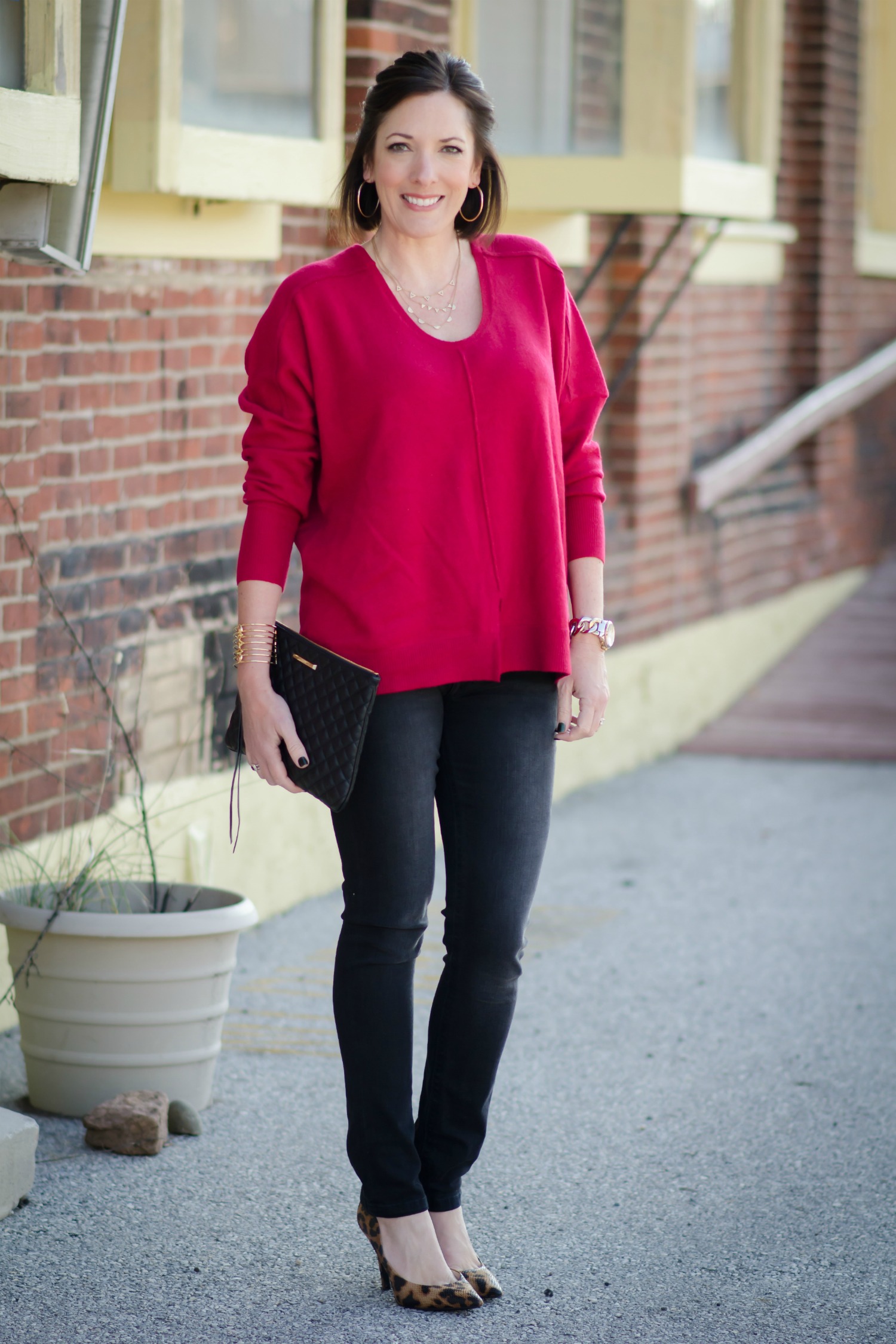 Winter Outfits for Moms: Oversized Red Sweater with Black Jeans and Leopard Flats or Leopard Pumps