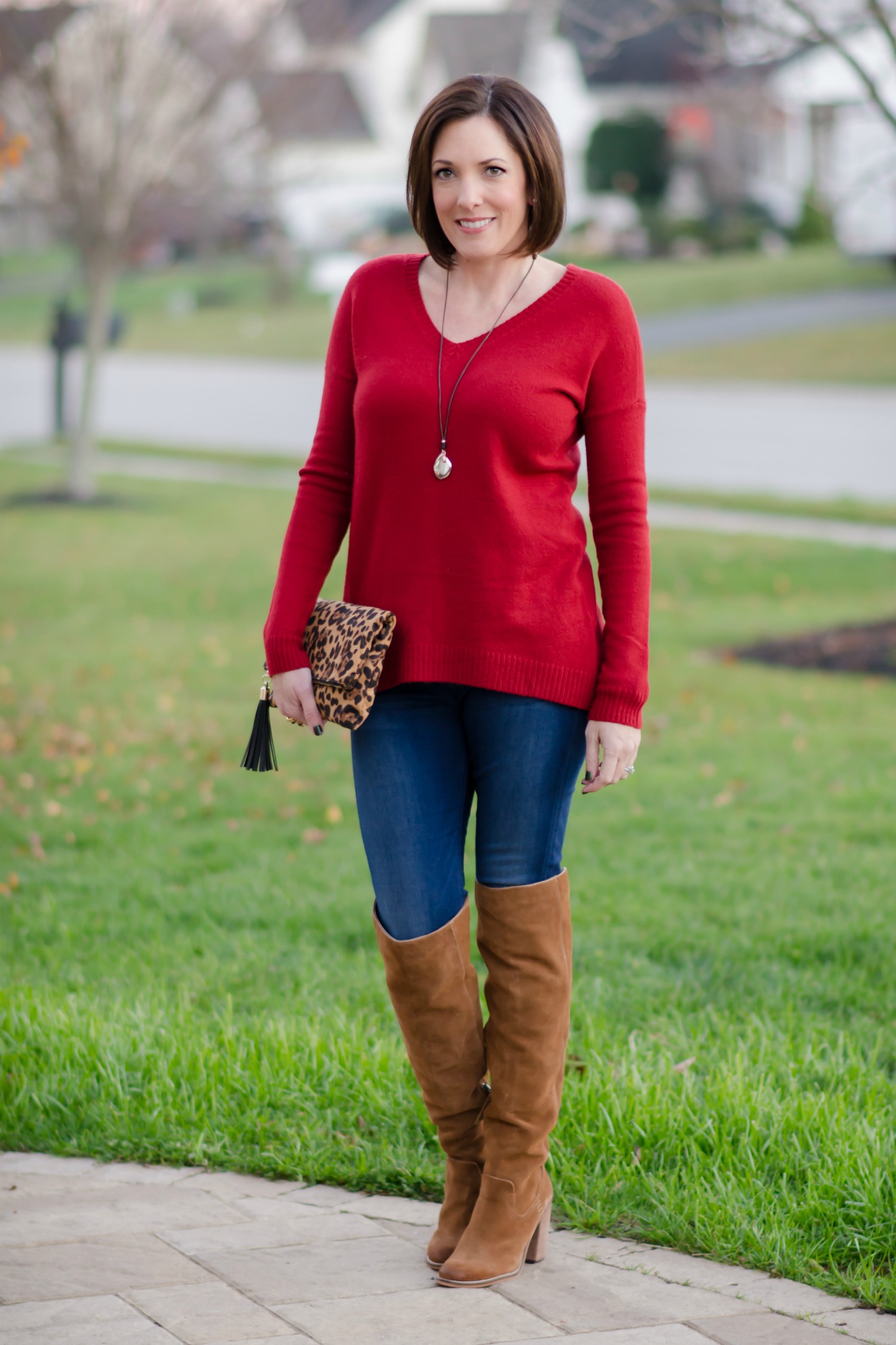 Red Split Back Boyfriend Sweater with Over the Knee Boots and Leopard Clutch
