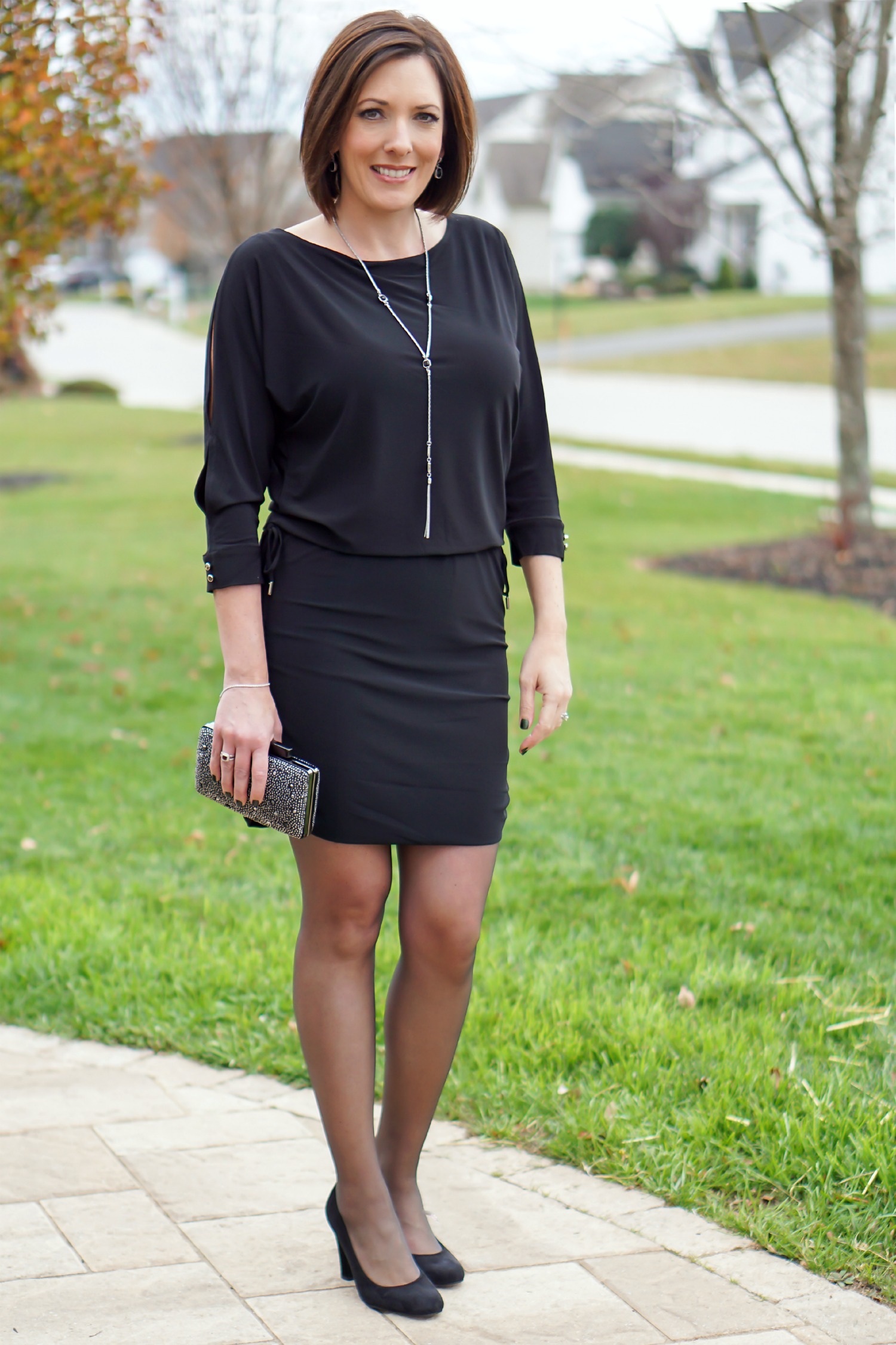 What to Wear to an Office Christmas Party: LBD with fun accessories, sheer black hose, and black suede pumps