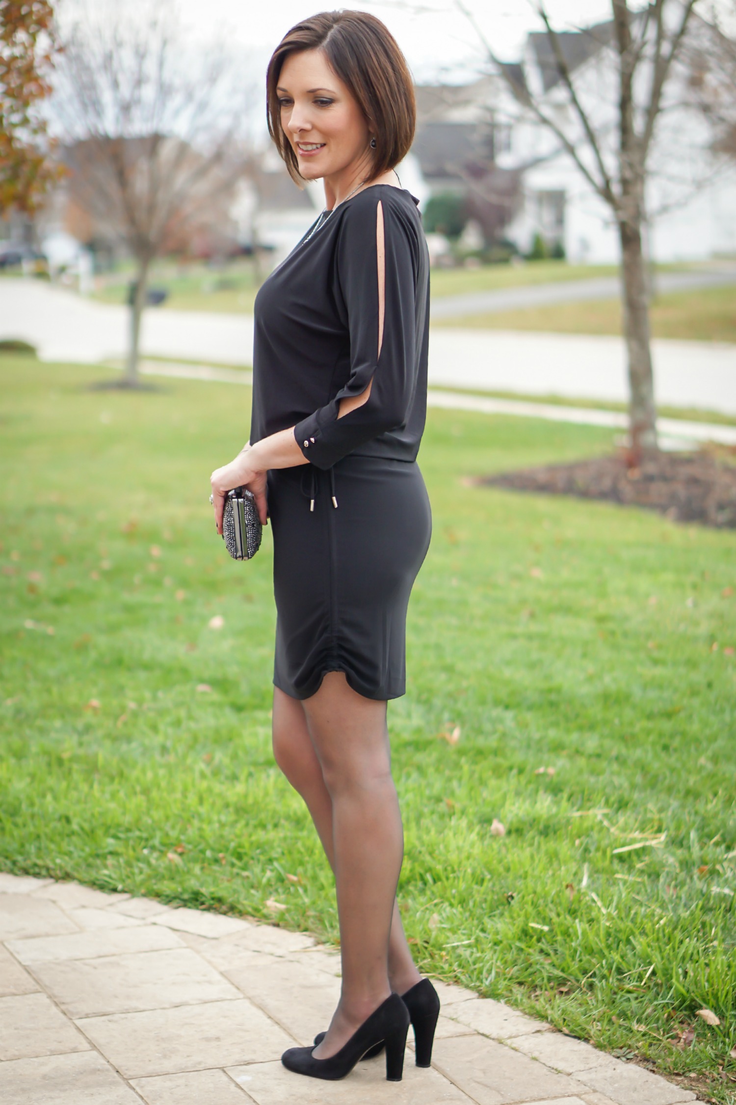 What to Wear to an Office Christmas Party: LBD with fun accessories, sheer black hose, and black suede pumps