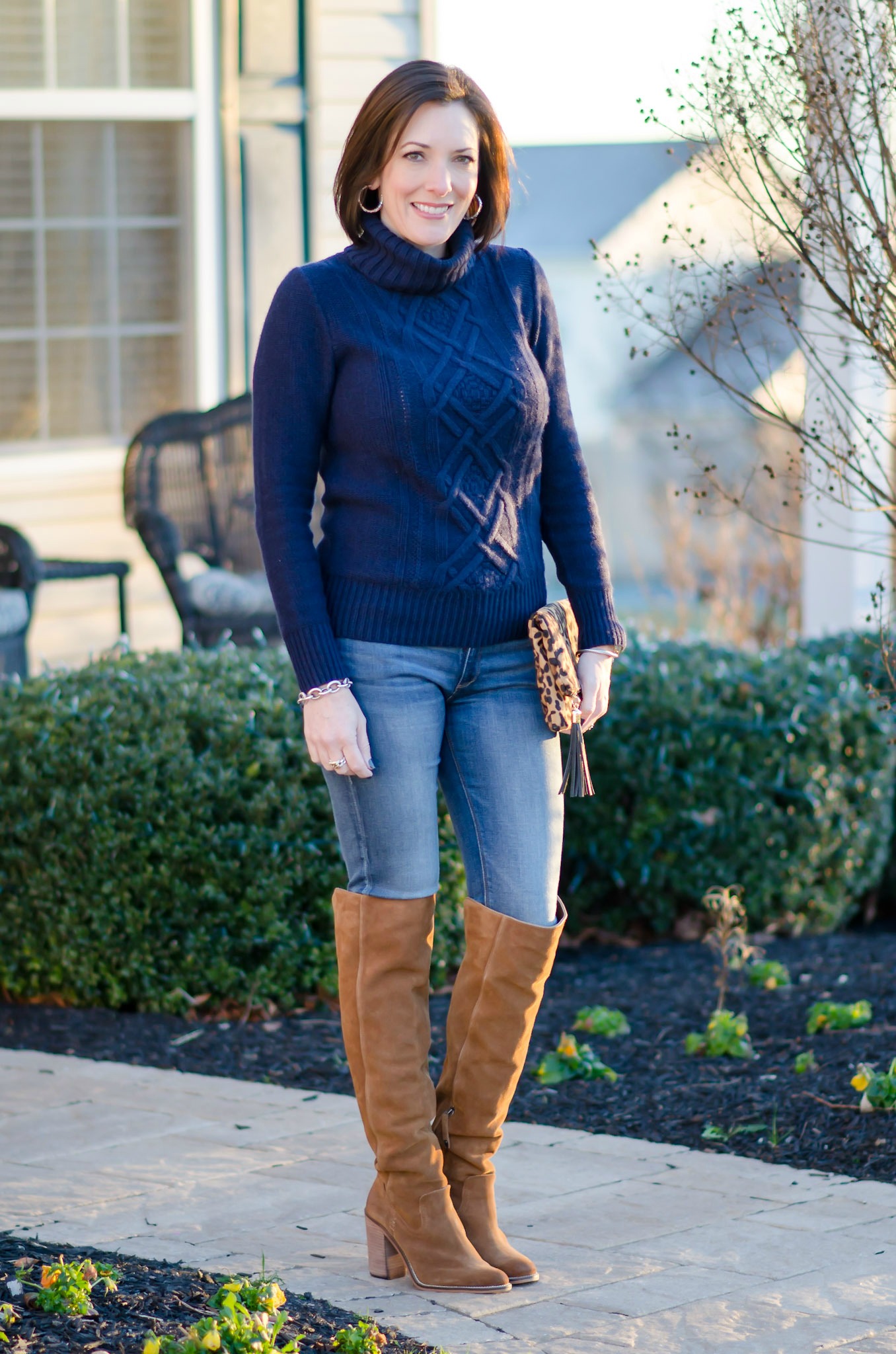 Wearable Winter Outfit Ideas For Women Over 40: Navy Turtleneck with Chestnut OTK Boots