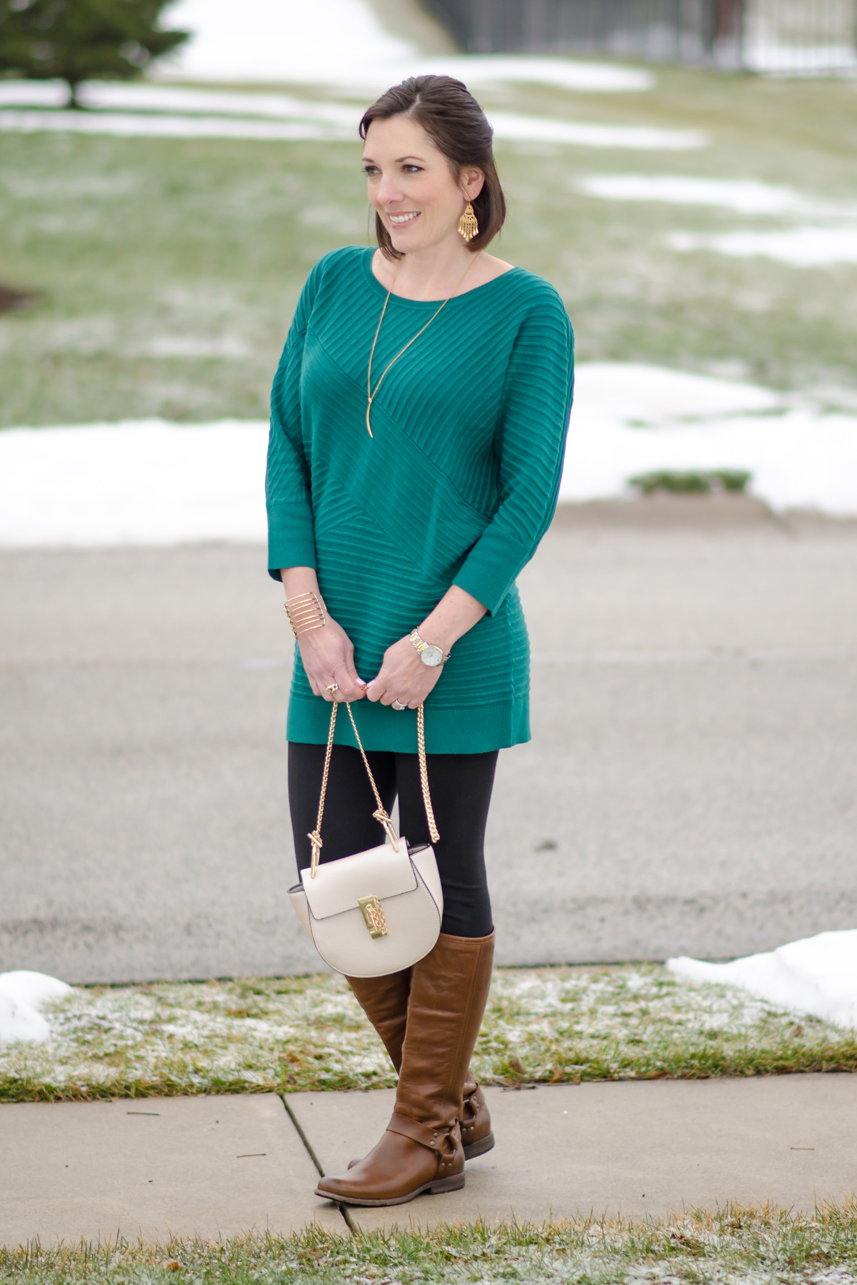 Spring Fashion for Women Over 40: green tunic, black leggings, brown Frye riding boots