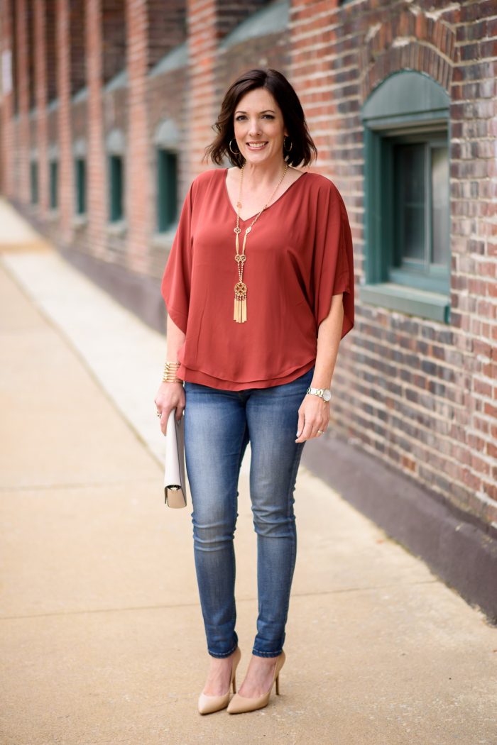How to Dress Up Casual Jeans: Jo-Lynne Shane wearing rust Kimono Blouse from White House Black Market with blue jeans and nude pumps. This is the perfect spring outfit for lunch with the girls or a casual date night.