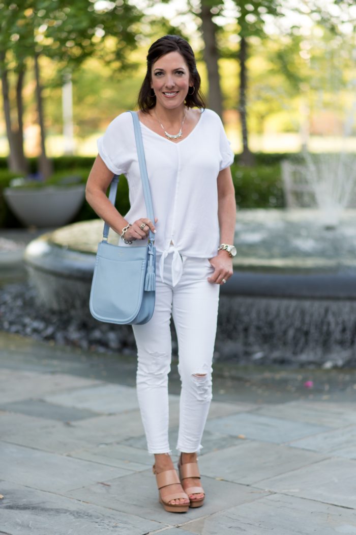 An all-white outfit might sound intimating, but it is the perfect fresh look for summer. Add a serenity blue handbag and nude wedge sandals for a modern look! Fashion Over 40 with Jo-Lynne Shane