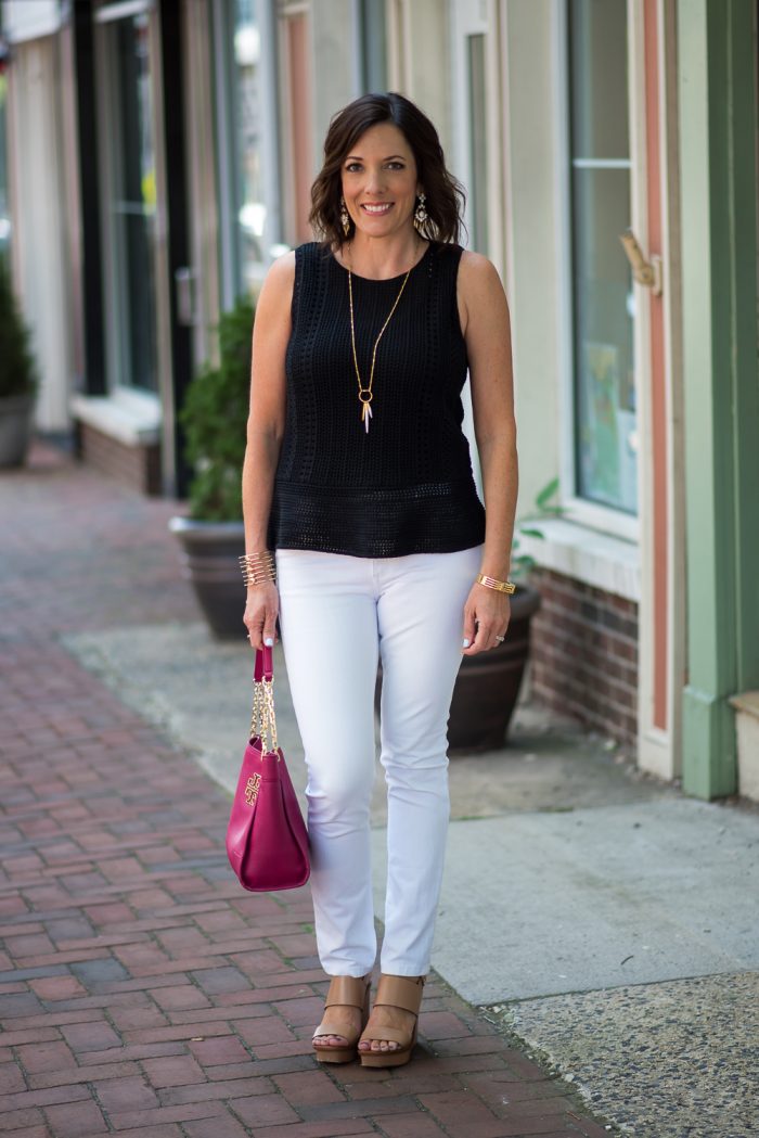 This black crochet peplum sweater with white jeans is a classic summer outfit that can take you from the office to dinner. 