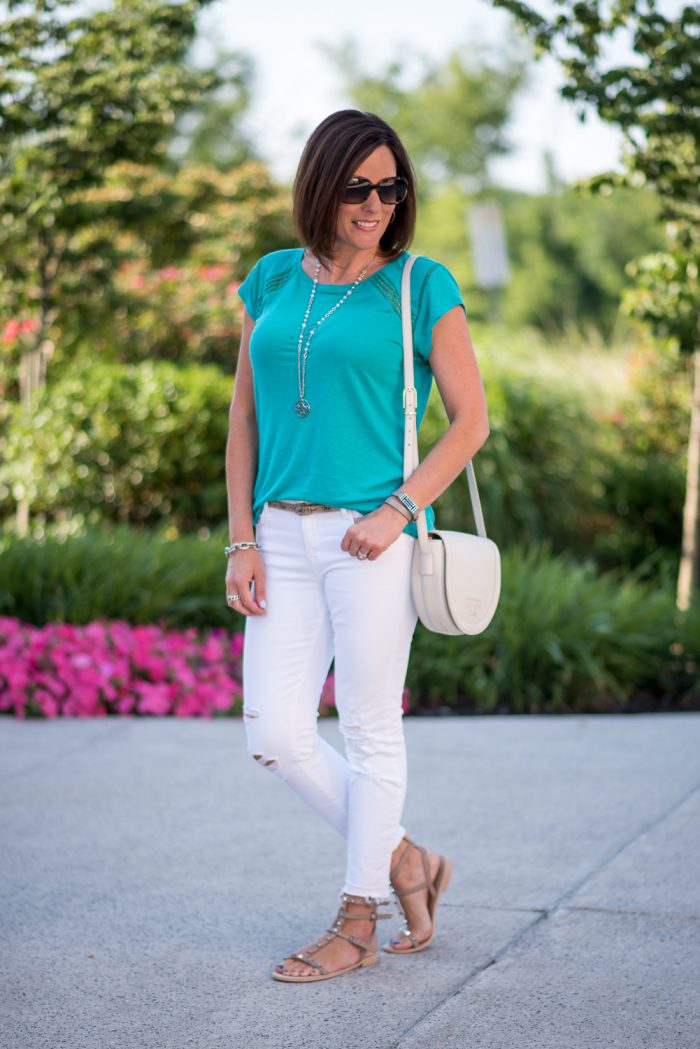 Fashion Over 40: This teal ladder lace linen top from LOFT is stunning paired with white jeans. The R Minkoff studded gladiator sandals are the perfectly chic finishing touch for this casual summer outfit!