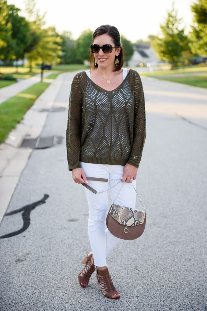 This openwork slouchy sweater is perfect for transition season. The knit is breathable and the cuffed sleeves feel just right pushed back to the elbow -- just add bracelets.