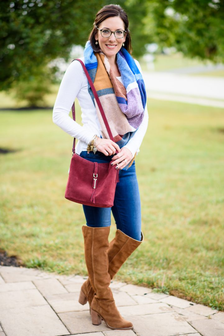 styling a blanket scarf and over the knee boots for a fun fall look