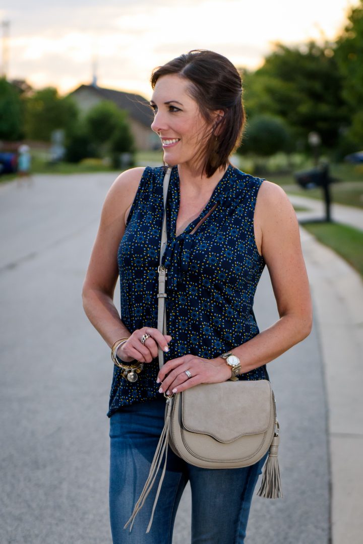 Fall Fashion Inspiration: Styling a bow neck top with skinny jeans, lace-up flats, and a tassel cross body bag. 