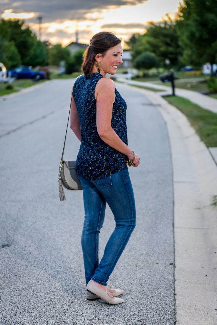 Fall Fashion Inspiration: Styling a bow neck top with skinny jeans, lace-up flats, and a tassel cross body bag. 