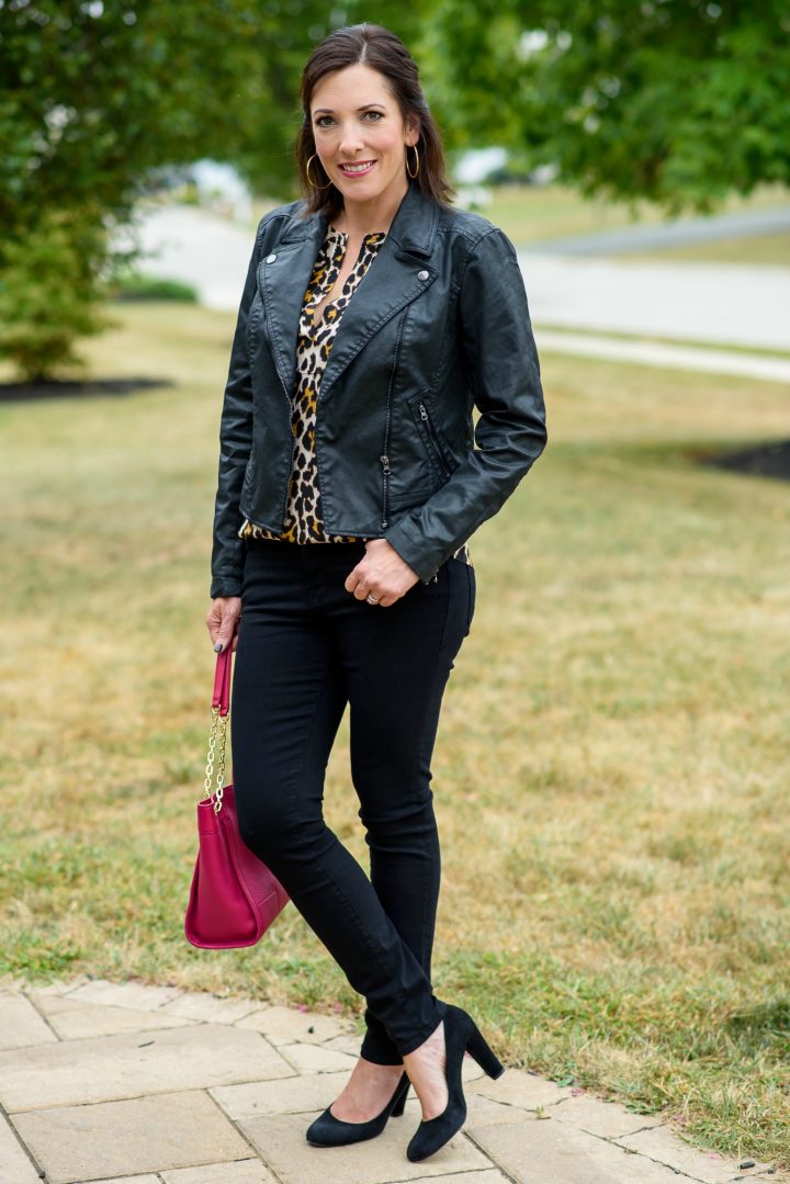 Leopard silk blouse with a moto jacket, black jeans, and a pop of pink!