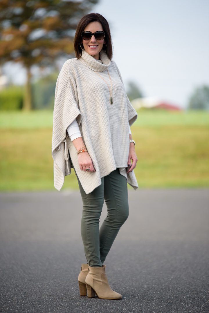 1 of 4 Ways to Wear Ankle Boots this Fall: with a chunky side tie poncho and olive skinny jeans! Click through for 3 more ways to wear ankle boots!