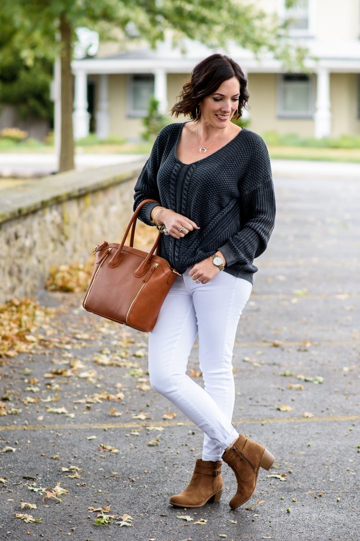 a white jeans outfit for fall featuring Rooda Ankle Strap Booties from Payless