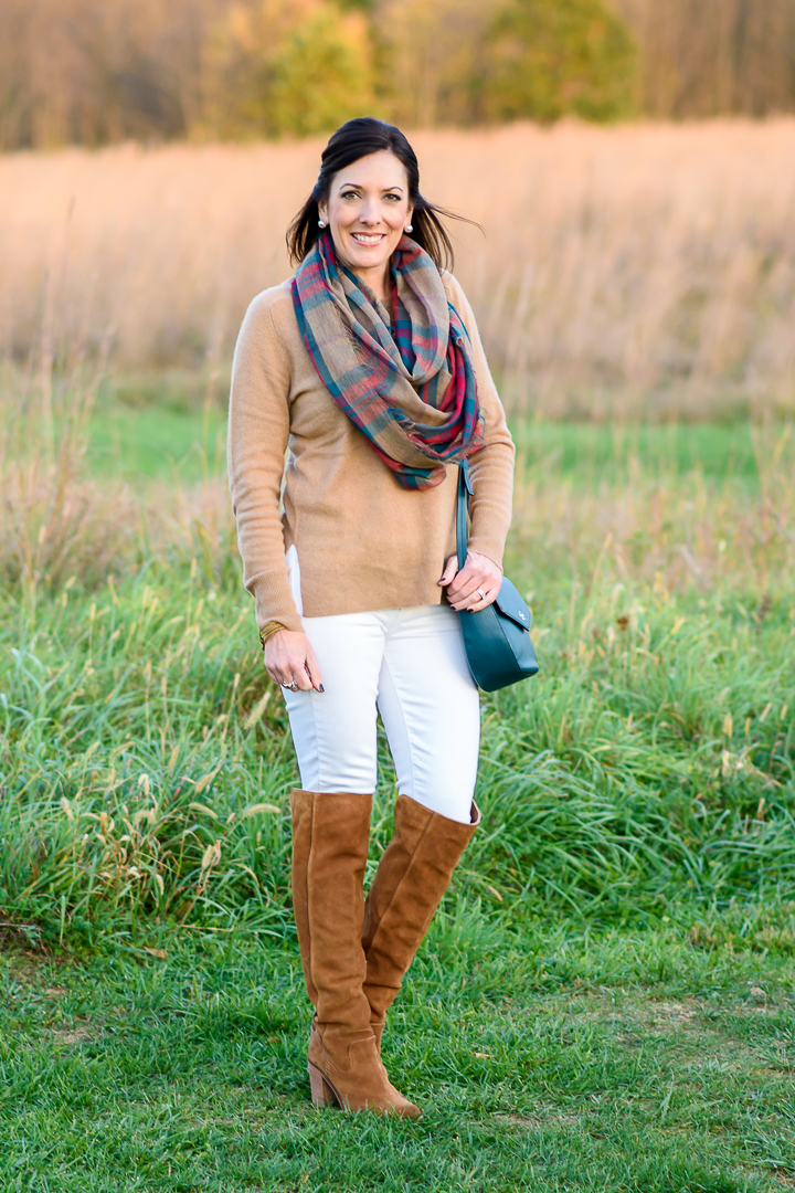 Another great way to style white jeans for fall -- camel cashmere sweater with white skinnies, chestnut over-the-knee boots, and a plaid infinity scarf.