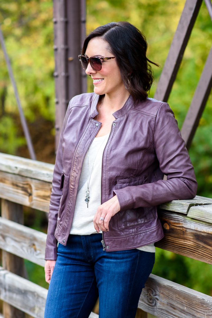 Fashion Over 40: plum leather jacket with beige tee, dark wash skinny jeans, and taupe booties
