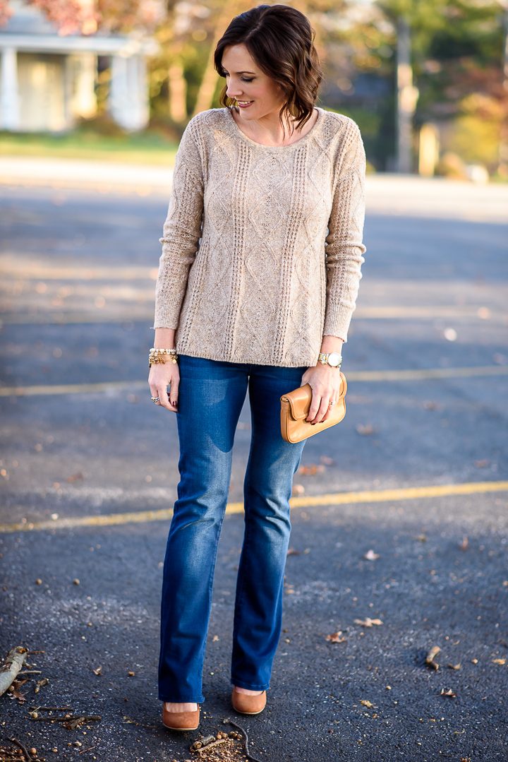 Thanksgiving Outfit Idea: oatmeal textured sweater with bootcut jeans and cognac suede pumps