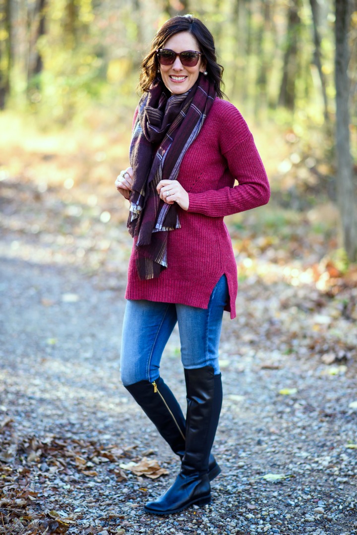 Casual Winter Outfit Inspo: Red Ribbed Mock Neck Pullover with Plaid Scarf, Skinny Jeans, and black leather OTK flat boots