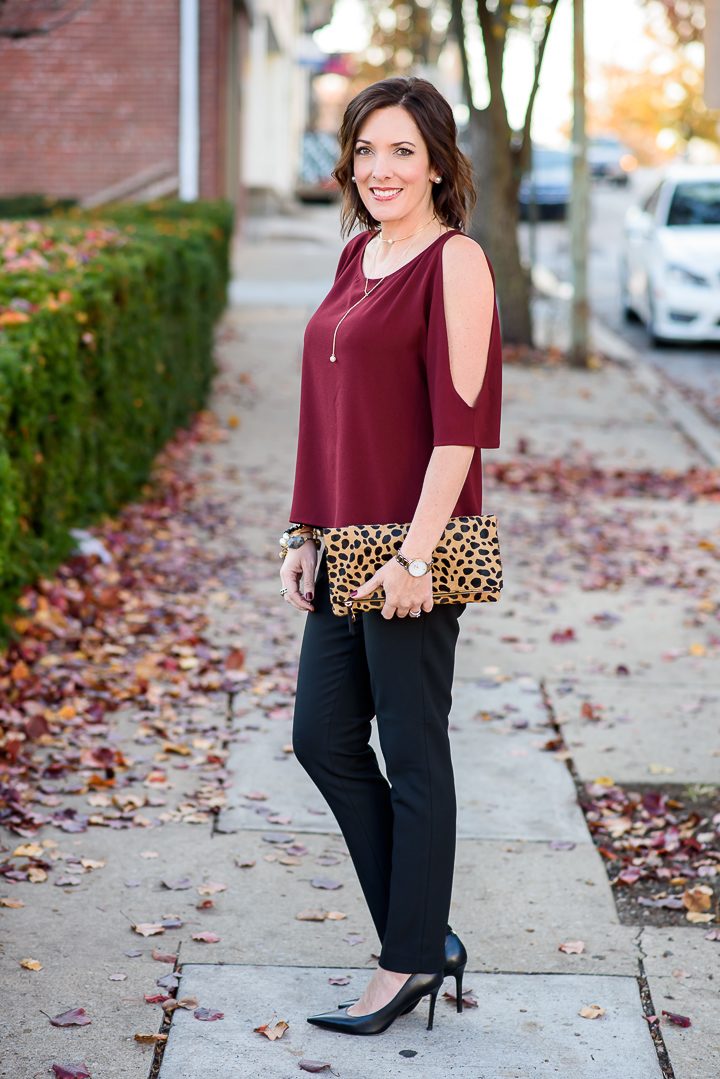 This chic holiday party pants outfit with cold shoulder top is perfect for an at-home party or casual at-the-office holiday party.