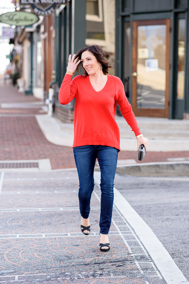 I've teamed up with @RidersbyLee to style a budget-friendly holiday date night outfit featuring their Bounce Back Skinny Jeans with a red sweater and black sparkly dress sandals from Payless.