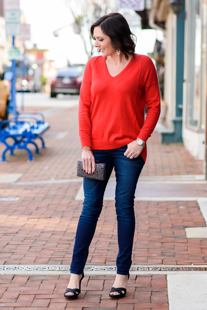 I've teamed up with @RidersbyLee to style a budget-friendly holiday date night outfit featuring their Bounce Back Skinny Jeans with a red sweater and black sparkly dress sandals from Payless.