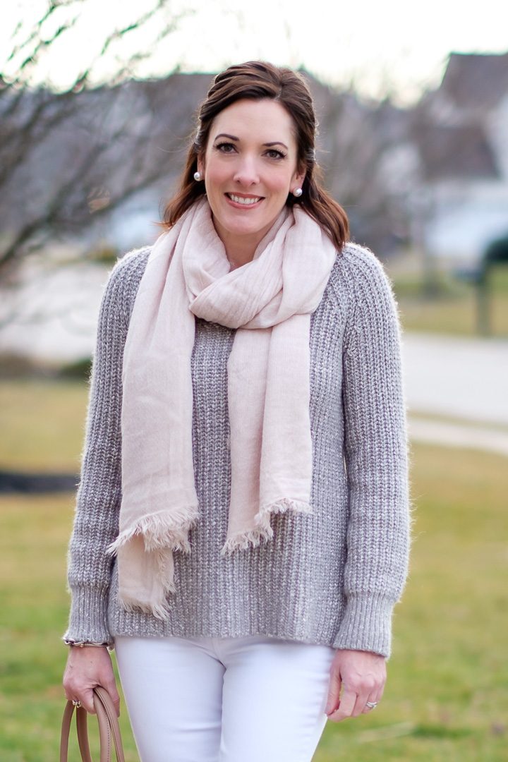 Bundled Up in Pastels: marled silver sweater and a blush scarf with white jeans and grey suede booties