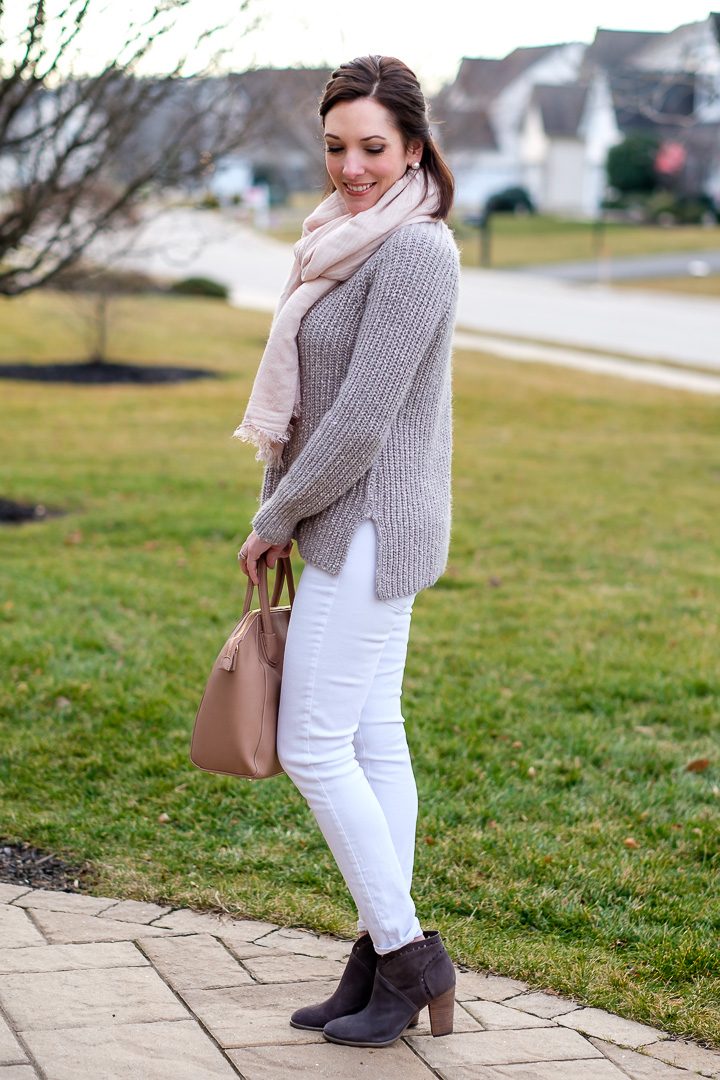 Loving this muted color palette for winter with a marled silver sweater and a blush scarf with white jeans and grey suede booties!