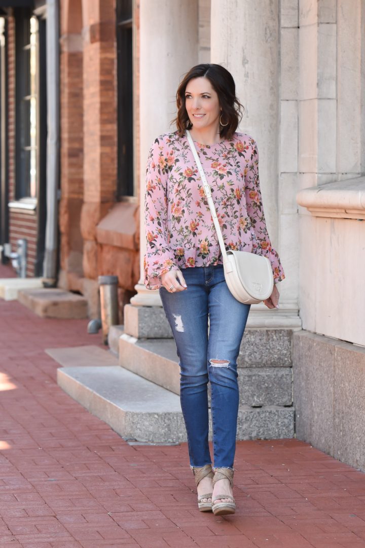 The perfect dressed-up casual going-out look for spring: floral trumpet sleeve top with AG raw hem ankle legging jeans & Stuart Weitzman Elixir espadrilles.