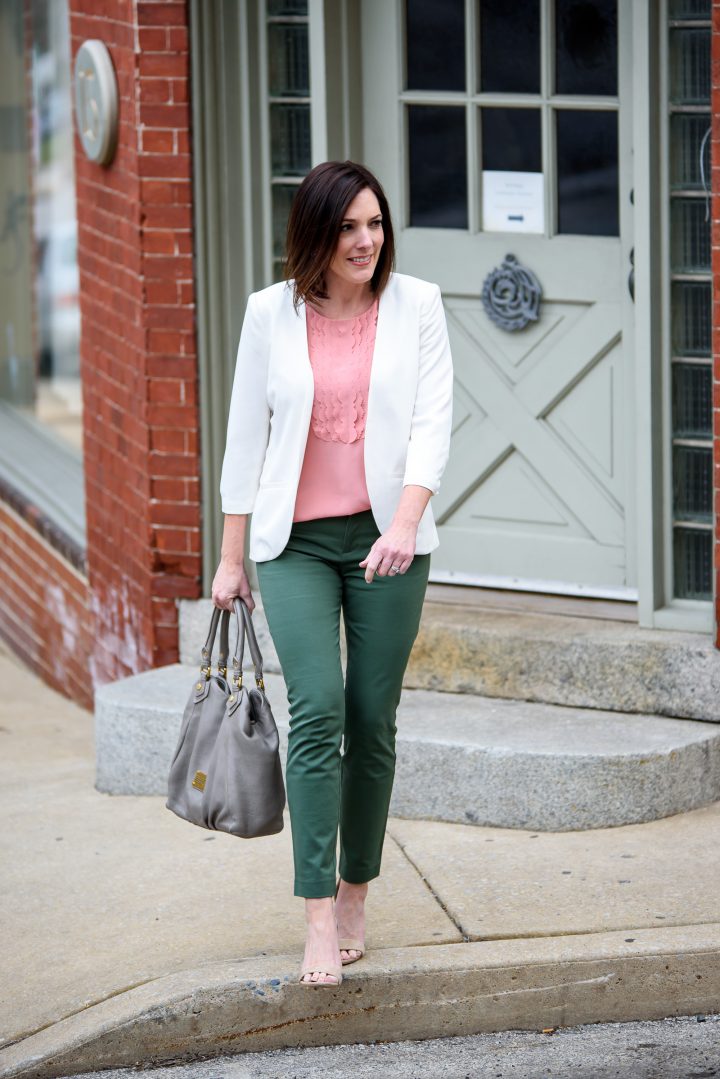 Jo-Lynne Shane in a spring work wear outfit featuring jungle green Gap bi-stretch skinny ankle pants, blush Banana Republic scallop front top, and white Chelsea28 crepe collarless blazer.