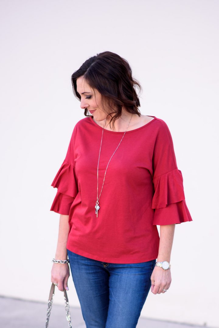 Styling this cute ruffle sleeve tee for $35 with AG raw hem legging ankle jeans and pewter lace-up flats for a casual spring outfit.
