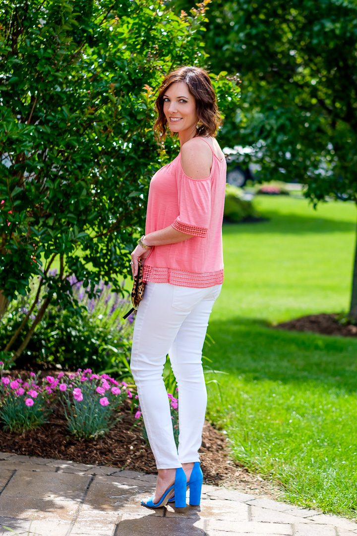 Summer Outfit Inspo: Coral Cold Shoulder Top with White Jeans and Leopard Clutch