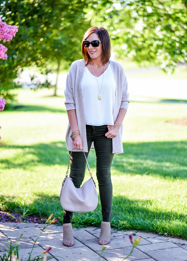 How to Wear Spruce Green Jeans: I topped my spruce green skinny jeans with a white cami and blush cardigan, and I added a pair of perforated peep toe booties in a coordinating shade of blush. Blush and spruce are a great combination, and I like how this combination lightens up the dark green jeans.