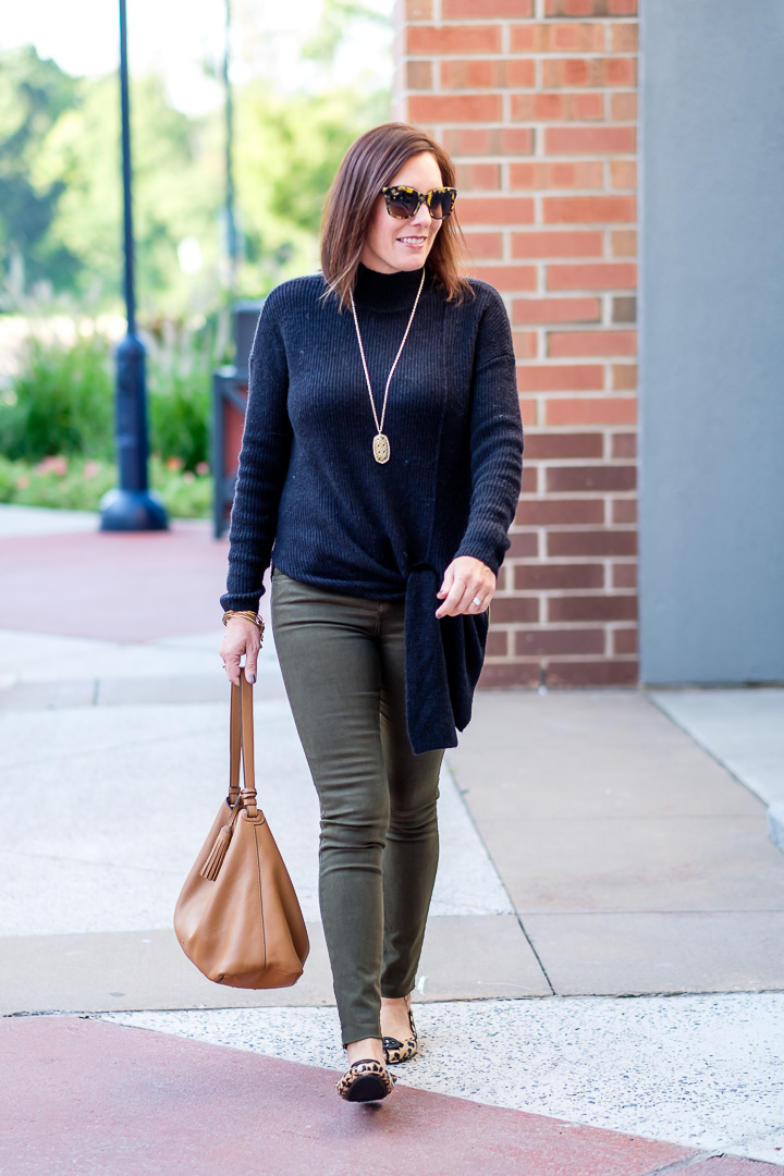 Fall Fashion for Women Over 40: This simple outfit is a combination of some of my favorite fall basics -- colored denim, leopard flats, a black sweater, and a neutral handbag.