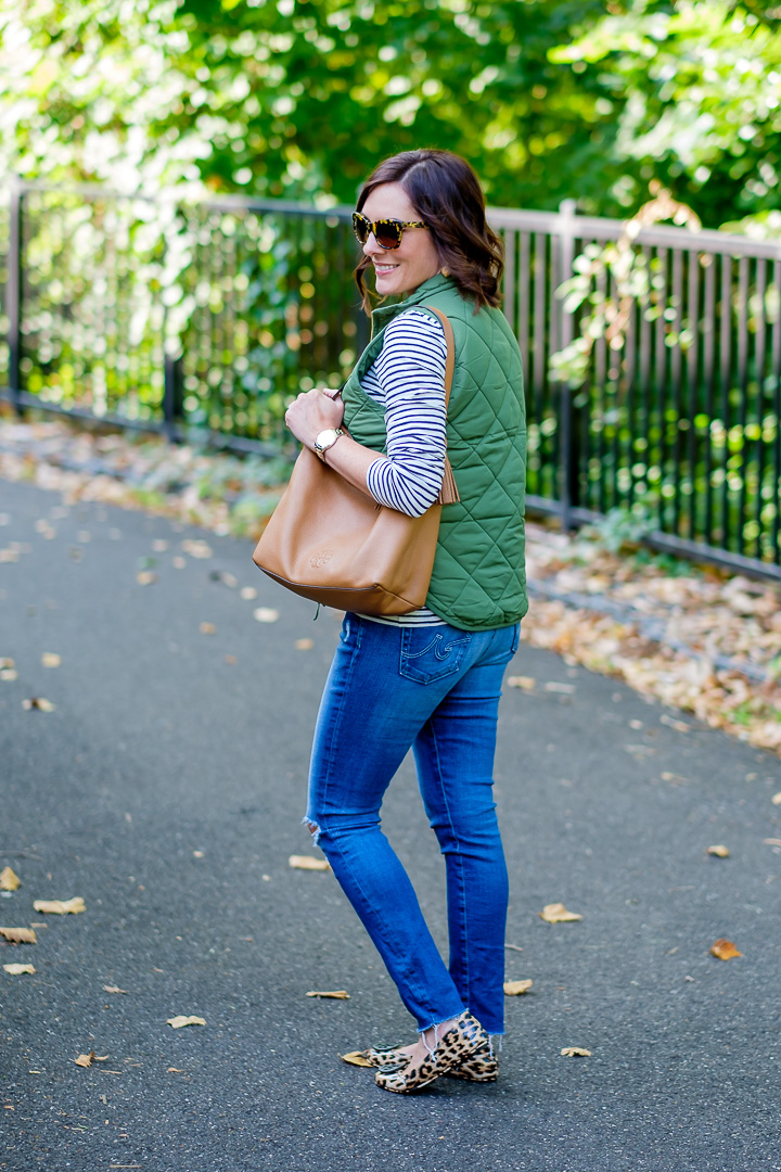 Jo-Lynne Shane wearing a classic quilted puffer vest outfit with a striped tee & leopard flats for Day 7 of 26 Days of Fall Fashion